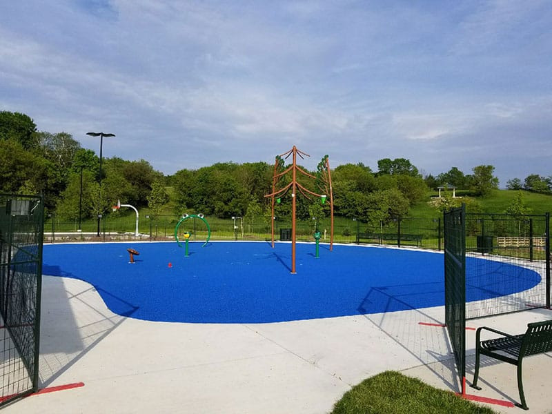 Colorful playground surface by Ure-tech Surfaces Inc with safety features.